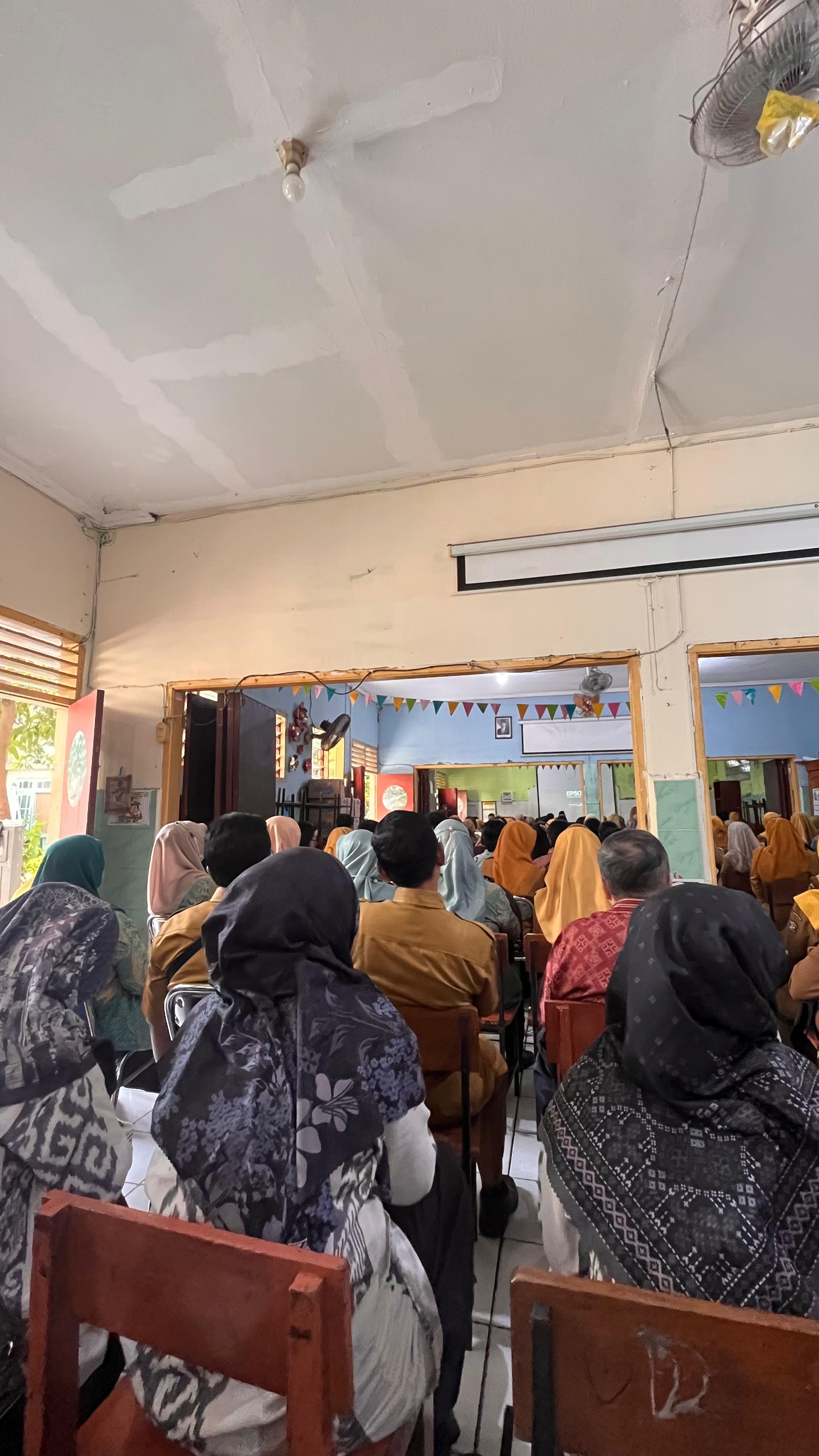 Mengikuti rapat sosialisasi ANBK